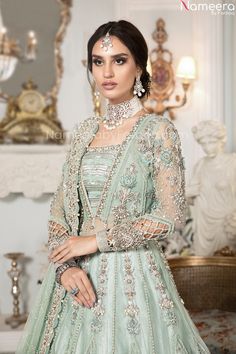 Premium Designer Peach and Sea Green Lehenga is emblazoned in work of kora, dabka, sequins, and zardozi work done on Gown paired with tissue fabric lehenga and net embellished dupatta in sea green color. Gown: Elegant Front Open gown is Heavily Embellished in work of tilla, sequins, dabka and kora work on gown including its front and back along with heavily embellished borders of the silver color on gown further enhanced with dangling pearls and tassels on the bottom and sleeves of the dress tha Sea Green Lehenga, Maria B Bridal, Mehendi Dress, Net Gowns, Backless Gown, Green Lehenga, Pink Lehenga, Anarkali Gown, Embellished Gown