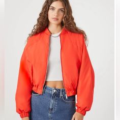 Forever 21 Orange Cropped Bomber Jacket New With Tags, Never Worn Size Small - This Jacket Has An Oversized Fit With Dropped Sleeves. Orange Woven Bomber Jacket Featuring A Flat Collar, Zip-Up Front, Front Pockets, Dropped Long Sleeves, Elasticized Trim, And A Cropped Hem. 100% Polyester Handwash Cold Trendy Oversized Cropped Jacket For Fall, Trendy Cropped Streetwear Outerwear, Oversized Cropped Jacket For Streetwear, Trendy Cropped Outerwear For Streetwear, Spring Cropped Outerwear With Zipper Closure, Cropped Outerwear With Zipper For Spring, Forever 21 Long Sleeve Spring Outerwear, Trendy Cropped Jacket For Fall, Casual Cropped Outerwear With Zipper Closure