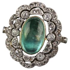 Beautiful Antique French Edwardian 18K Gold Platinum Diamond Cabochon Emerald Ring - GIA. This gorgeous antique Edwardian ring is crafted in 18k yellow gold and platinum. This ring features a gorgeous cat's eye cabochon emerald that has a GIA report in the center of a gorgeous Edwardian diamond mounting. The ring sits low on the finger and is in great condition. Item #R1910 Metal: 18K Yellow Gold and Platinum Weight: 4.5 Grams Size: 6 1/2 Diamonds: Approximately .50 cts Color: H Clarity: VS2 - SI1 Emerald: 3.23 cts - GIA # 2235102009 Measurements: Top of the ring measures 19.50 mm wide and band measures 1.75 mm wide. Measurements off the finger: 7.85 mm high Layaway: For your convenience, we will be happy to provide layaway payment options. Please contact us to work out a layaway plan whic Antique Emerald Ring, Edwardian Engagement Ring, Edwardian Ring, Gorgeous Engagement Ring, Engagement Ring Diamond Cut, Antique Engagement, Antique Engagement Rings, Shiny Things, Emerald Stone