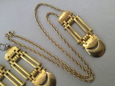 "Jakob Bengel brass watch fobs re-imagined and re-designed as rectangular pendant and screw back earrings. Great looking jewelry set. It would fall into the chunky category. Moderately heavy but very large pieces. Quite Avant Garde, Art Deco, Machine Age, Modernist. Created in the 30's and repurposed later. 1930s Necklace 24\" long 25.2 gram wt. (for pendant and necklace) Pendant: 3 1/4\" x 1\" Earrings: 3 1/4\" drop x 1\" W 17.9 gram wt (each earring) Attention: All items are listed to the best Vintage Bronze Rectangular Jewelry, Antique Bronze Rectangular Jewelry, Antique Rectangular Bronze Jewelry, Antique Rectangular Brass Jewelry, Gold-tone Brass Rectangular Jewelry, Rectangular Brass Jewelry In Gold-tone, Rectangular Gold-tone Brass Jewelry, Vintage Brass Rectangular Jewelry, Vintage Rectangular Brass Jewelry