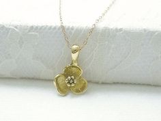 Gold flower necklace- simple dainty necklaceThree petal flower charm hangs on a dainty 14K gold filled chain.  Simple and dainty jewelry, a great everyday necklace.>>>measurements<< Delicate Flower Charm Necklace With Delicate Chain, Dainty Brass Necklace With Flower Pendant, Dainty Brass Flower Pendant Necklace, Everyday Gold Flower Necklace, Gold Flower Charm Necklaces For Everyday, Delicate Gold Flower Charm Necklaces, Delicate Gold Charm Necklaces With Flower Shape, Dainty Flower Charm Necklaces, Delicate Gold Charm Necklace With Flower