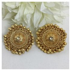 *PRODUCT DETAIL* *Material: Brass *Plating: 22K Antique Gold Plated *DIMENSIONS * *Earrings: Weight: 22 gm each, Length: 4 Inches, Width: 1.7 Inches *ABOUT PRODUCT* *Exclusive 22K Antique Gold Plated Stud Earrings in Antique Design. *Style Tip: Team It with Daily your Formal Indian Attire. *DISCLAIMER* *Product & color may slightly vary due to photographic lighting sources or your screen settings. Traditional 22k Gold Bridal Earrings For Festive Occasions, Traditional Yellow Gold Jhumkas For Wedding, 22k Gold Jhumkas For Wedding And Navratri, Festive Yellow Gold Bollywood Danglers, Navratri Chandbalis With Intricate Design, Brass Chandbali Bridal Earrings, 22k Gold Chandbali Bridal Earrings With Latkans, Gold Jhumkas With Intricate Design For Festive Occasions, Festive Gold Jhumkas With Pallu