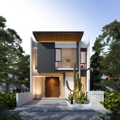 two cars are parked in front of a modern house at night with cactus and cacti