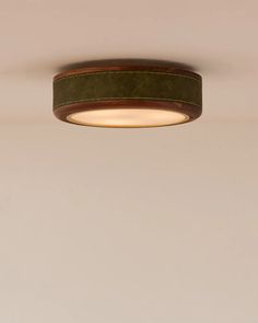 a round light fixture hanging from the ceiling