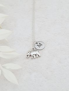 Personalised elephant necklace engraved with an initial of your choice. This customisation makes this a special gift for someone or a little gift for yourself. Elephant measures 13mm x 9mm. Initial disc measures 10mm in diameter and is stainless steel. Necklaces will arrive in a bag ready for giving. Nickel Free Pendant Charm Necklace For Best Friend, Nickel-free Pendant Charm Necklaces For Best Friend Gift, Nickel-free Pendant Charm Necklace For Best Friend, Dainty Silver Charm Necklace For Mom, Nickel-free Round Pendant Charm Necklaces For Best Friend Gift, Nickel-free Round Pendant Charm Necklace For Best Friend, Personalized Silver Dangle Charm Necklaces, Silver Initial Pendant Charm Necklace Nickel Free, Silver Hand Stamped Necklace For Best Friend