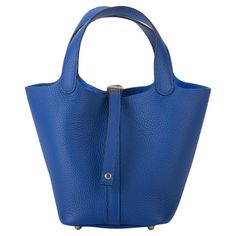 Hermès picotin 18cm in blue royal taurillon clemence leather and gold tone hardware. Handle drop 5”. Date stamp U for 2022. Comes with booklet, original dust cover, box and ribbon. Date Stamp, Dust Cover, Fashion Handbags, Top Handle Bag, Gold Tones, Band, Handbags, The Originals, Leather