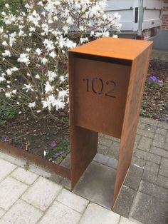 a mailbox with the number 120 on it