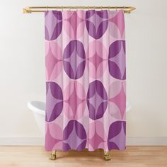 a pink and purple shower curtain with circles on it