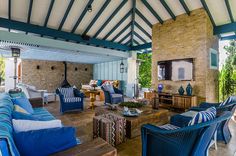 an outdoor living room with blue and white furniture