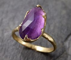 I created this setting in wax then cast it in recycled solid 18k Yellow gold at my home studio. This ring is a size 7 it can be sized. The stone is Amethyst. it measures about 14mm X 7mm I created a rustic texture in the gold. Throughout all time and history, in every tribe and culture all around the world crystals, minerals and gemstones have used for healing, luck, divination, adornment vibrational medicine and so much more. Tourmaline is a very balancing stone and helps heal and open the hear Vibrational Medicine, Pink Gemstones Ring, Raw Gemstone Ring, Gold Solitaire Engagement Ring, Rustic Texture, Pink Tourmaline Ring, Gold Statement Ring, Wedding Rings Solitaire, Gemstone Engagement