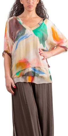 Abstract Painted Design on 100% Silk Blouse with Frayed Raw Edge Hemline. Soft, Stretchy Viscose Layer Underneath. 100% Silk Exterior | 95% Viscose | 5% Elastic Interior Made in Italy Fits Sizes XS- XL Model 5'7 Summer Beige Silk Blouse, Beige Silk Blouse For Summer, Summer Beige Viscose Blouse, Beige Viscose Summer Blouse, Casual Multicolor Silk Top, Chic Multicolor Viscose Blouse, Multicolor Silk Short Sleeve Top, Flowy Silk Blouse For Spring, Casual Flowy Silk Tops