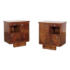 a pair of wooden nightstands sitting next to each other on top of a white background