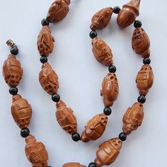 Vintage carved olive pit Hedaio bead necklace.  17 beads in the strand, total length is 23" Beautiful detail, no notable flaws. Happy to answer any additional questions. Traditional Adjustable Carved Beaded Necklace, Brown Carved Round Bead Necklaces, Vintage Carved Round Beads Necklace, Vintage Orange Hand-strung Beaded Necklace, Vintage Orange Large Beads, Beaded Necklaces, Bead Necklace, Necklace Etsy, Beaded Necklace