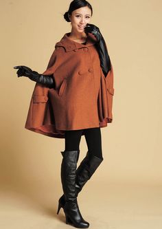 "How gorgeous is this classic brown cape with hooded, hip pockets . It's long enough to reach the back of the hand, keeping you warm but keeping your hands available when needed as a winter cape, but also a perfect option when pregnant. Made from soft wool fabric, the short cape is completely lined in polyester with fabulous flap detailing on the front, shoulders, pockets and back. This is a cape coat you will wear forever. **Detail** * Wool blend, 50% wool, 50% fiber, nylon * Fully satiny lined Hood Cloak, Brown Cape, Wool Cloak, Women Cape, Cape With Hood, Winter Cape, Cape For Women, Plus Size Coat, Orange Coat