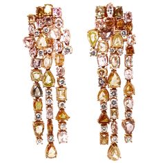 This 18K rose gold exclusive chandelier earrings are from our Divine collection. These chandelier earrings are a perfect combination of natural white diamonds in total of 1.22 Carat and fancy yellow diamonds in total of 7.51 Carat. The total metal weight is 21.04 Carat.They are 5.5 cm long. The piece of jewellery is a perfect addition to any special occasions. The Divine Collection has a unique blend of history, tradition and modern refinement inspired by the baroque period and its sophisticated style, providing extreme magnificence and prestige in all its pieces. As in the Baroque art, the jewellery is an elaborate and highly detailed work of art representing the company’s heritage and celebrating the history of the country where it all started, Italy. The Divine collection by VITALE 1913 Rose Gold Jewelry Outfit, Contemporary Jewelry Earrings, Gold Statement Jewelry, Art Deco Drop Earrings, Pink Gold Jewelry, Yellow Diamond Earring, Baroque Period, Gold Diamond Drop Earrings, Black Diamond Bands