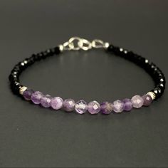 Gemstone: 4mm Natural Purple Amethyst Crystal 3- 3.5 Mm Faceted Beads And Black Tourmaline Beads Metal: Solid Sterling Silver ( Made To Order In Gold Filled ). Amethyst Beaded Bracelets With Spacer Beads As Gift, Purple Sterling Silver Beaded Bracelets With Round Beads, Silver Crystal Bracelet With Amethyst Beads, Silver Amethyst Beaded Bracelets With Faceted Beads, Silver Amethyst Beaded Bracelets With Natural Stones, Silver Amethyst Beaded Bracelet With Faceted Beads, Silver Amethyst Crystal Bracelet With Gemstone Beads, Elegant Amethyst Rondelle Beaded Bracelets, Elegant Hand-strung Amethyst Beaded Bracelets