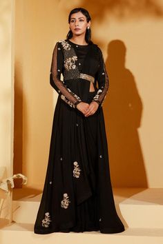 Black pre-draped saree in georgette crepe base. Comes with a jacket blouse with an attached cinched belt on waistline and floral, thread and sequins embroidery.
Components: 2
Pattern: Embroidered
Type Of Work: Floral, Thread, Sequins
Neckline: Round
Sleeve Type: Full
Fabric: Georgette crepe
Color: Black
Other Details: 
Attached lining
Product Weight: Approx 4-5 Kgs
Model Height: 5ft 7inches, wearing size S
Closure: Blouse - Back zip and hook
Occasion: Sangeet - Aza Fashions Festive Pre-draped Maxi Length Georgette Saree, Silk Anarkali Blouse Piece For Evening, Silk Anarkali Blouse For Evening, Front Open Georgette Anarkali Set For Reception, Elegant Front Open Anarkali Set In Georgette, Anarkali Blouse Piece With Dupatta For Evening, Evening Anarkali Silk Blouse Piece, Elegant Front Open Georgette Anarkali Set, Black Pre-draped Saree With Zari Work