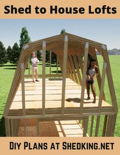 two children are standing on the roof of a house that is made out of wood