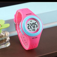 Simple and classic kids digital watch by SKMEI for ages 5 to 10 Features clear numbers for kids with alarm, stopwatch, date and 12/24 hour functionality This child watch has a LED light for easy viewing in the dark This kids waterproof watch is safe for wearing while in shower or swimming. Watch is 50M Waterproof (5Bar). Please note that buttons should not be pressed while its submerged in water Makes a great gift for boy or girl on Christmas, Birthday, Back to School and more Watch Kids, Numbers For Kids, Waterproof Watch, Classic Kids, Kids Watches, Garmin Watch, Digital Watch, Christmas Birthday, Gifts For Boys