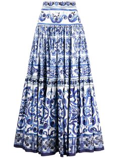 Majolica tiered maxi skirt from DOLCE & GABBANA featuring white, royal blue, cotton, all-over graphic print, high waist, tiered skirt, curved hem and ankle-length. | Dolce & Gabbana Majolica tiered maxi skirt Blue Print Skirt, Blue Long Skirt Outfit, Blue Long Skirts, Greek Skirt, White Long Skirt Outfit, Dolce And Gabbana Skirt, Long Summer Skirts, Blue Skirt Outfit, Long Skirt Floral