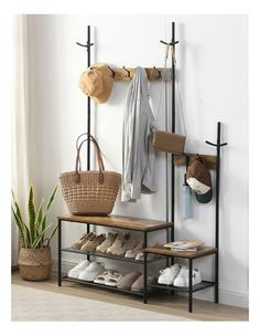 a coat rack with shoes and hats hanging on it