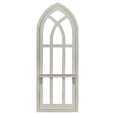 a white arched window on a white wall