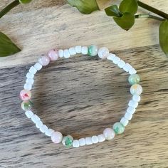 Brighten Up Your Day With Our Handmade White Beaded Bracelet! This Charming Accessory Is Crafted With High-Quality Beads And A Durable Elastic String, Making It Comfortable To Wear And Perfect For Any Occasion. Featuring A Lovely Mix Of Soft Pastel Shades, This Bracelet Is The Perfect Way To Add Personality To Your Outfit. Wear It To The Office, Out With Friends, Or Even Just Around The House - This Bracelet Is Versatile And Fun! Our Handmade Bracelet Is A Thoughtful And Genuine Gift For Anyone Casual Beaded Bracelets With Round Beads For Spring, Bohemian Round Beads Bracelets For Spring, Bohemian Spring Bracelets With Round Beads, White Bohemian Bracelets For Spring, White Bohemian Bracelet For Spring, Bohemian Stretch Bracelet With Round Beads For Spring, Bohemian Beaded Bracelets With Tiny Beads For Spring, Casual Tiny Beads Bracelets For Spring, Casual Tiny Beads Bracelet For Spring