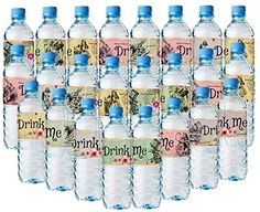 a bunch of water bottles with labels on the top and bottom, all labeled drink me