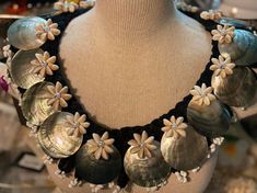 "Beautiful shell necklace Perfect for for both male and female. NOTE- There are 15 x 59.5 mm black lip mother of pearl shells & 17 x cowrie rosettes on this neckpiece. MEASUREMENT- approximately 59.9 mm black lip mother of pearl shells & 32\" inches around the neck. These are perfect for tropical wear, hula supplies or beach weddings and your wedding party can wear them over and over again . Please note: The actual color may vary slightly from what you see, due to differences in how monitors dis Handmade Black Shell Necklaces, Handmade Black Shell-shaped Jewelry, Handmade Black Shell Jewelry, Tropical Wear, Ribbon Lei, Hawaiian Plumeria, Black Lips, Foam Flowers, Tail Feathers