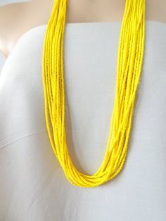 Long Yellow beaded necklace,yellow boho necklace,bridesmaids necklaces,seed bead jewelry,bridesmaids gift,multi strand necklace,summerIt has 12 strands and is available in several lengths. Please read specifications on SIZES below:❤ SIZESThis item comes in several sizes, kindly choose at checkout. The easiest way to find out which length suits you best is to measure a necklace you already own, from one end to the next, including clasp. You can also use the diagram on the pictures as a reference, Yellow Round Bead Necklaces For Summer, Yellow Round Beads Necklace For Summer, Tiny Yellow Beads For Summer, Yellow Beaded Necklaces With Round Beads For Summer, Yellow Beaded Chain Necklaces For Summer, Yellow Beaded Necklaces For Summer, Bohemian Yellow Single Strand Beaded Necklace, Yellow Bohemian Single Strand Beaded Necklace, Summer Yellow Beaded Necklaces