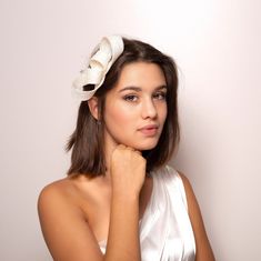 This bridal bow fascinator is designed in the shape of an elegant, simple bow. The minimalist ivory fascinator has enough glamour to elevate your style, effortlessly complementing a range of bridal or wedding guest ensembles. Modern bridal fascinator is made of millinery sinamay, it is feather light. While lightweight, sinamay is surprisingly durable, ensuring that the fascinator maintains its shape and structure over time. Place it into an elegant updo or romantic half loose hair, it easy to do Elegant Bridal Accessories With Satin Bow, Chic Kentucky Derby Headband Fascinator, Elegant Summer Event Hair Accessories, Chic Summer Evening Hair Accessories, Chic Hair Accessories For Wedding And Kentucky Derby, Elegant Summer Event Headband, Chic Headband Fascinator For Events, Chic Hair Accessories For Wedding At Kentucky Derby, Chic Fascinator Headband For Events