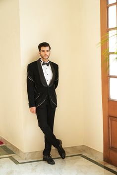 Soul Black Tuxedo Set - Contrast by Parth Minimal yet blingy, a tuxedo set made to perfection Included in purchase: Jacket, Kurta and Pants Product Specification Color: Black (can be customized) Fabric: Italian Suiting Occasion: Formal Event, Wedding, Bridal, Reception Style: Tuxedo Designer: Contrast by Parth Care: Dry Clean Only Work: Hand Embroidered, Mirror ( Variation in color, fabric & detail is possible. Model images are only representative.) This can be customized in any color, size or s Tailored Evening Party Wear Suits, Tailored Embellished Sets For Party, Black Tuxedo For Evening Party Wear, Black Tuxedo For Evening Party, Black Party Wear Tuxedo For Evening, Tailored Sets For Black-tie Festive Events, Black Party Wear Suits For Evening, Designer Embellished Tuxedo For Semi-formal Events, Festive Tuxedo Sets For Black-tie Events