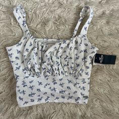 Size Medium Never Worn! Super Soft Material White Casual Tank Top With Floral Print, Casual White Tank Top With Floral Print, Casual White Floral Print Tank Top, Casual Floral Print Crop Top Tank, Blue Floral Print Casual Tank Top, Blue Floral Print Cotton Tank Top, Blue And White Floral, Floral Tank Top, Floral Tank