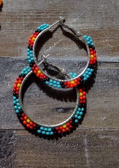 Colorful tribal hoop earrings on metal lever back hoops Adjustable Multicolor Nickel-free Jewelry, Bohemian Multicolor Hoop Earrings, Small Hoop Beaded Metal Earrings, Beaded Small Hoop Earrings In Metal, Beaded Hoop Festival Jewelry, Colorful Dangle Hoop Earrings With Ear Wire, Colorful Dangle Hoop Earrings, Beaded Hoop Jewelry For Festivals, Handmade Multicolor Metal Hoop Earrings