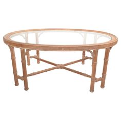 an oval glass and bamboo coffee table