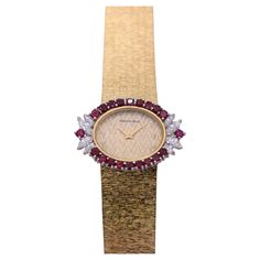 This elegant 18k yellow gold ladies cocktail watch was designed and created in Geneva Switzerland by Bueche-Girod during the 1970's. Featuring an oval head, and herring bone pattern dial with some minor staining, it is surrounded by luxurious round rubies, punctuated by eight fine quality marquise diamonds. Total measure to the outside of the ruby and diamond bezel is 35mm by 24mm. The movement is original to the watch and is a mechanical ultra-thin model. The integral 18k Bueche-Girod light bar Bone Pattern, Cocktail Watch, Vintage Gold Bracelet, Modern Bracelets, Geneva Switzerland, Cuff Watch, Wide Bracelet, Yellow Gold Bracelet, Marquise Diamond