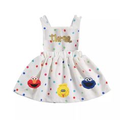 a white dress with sesame characters on it