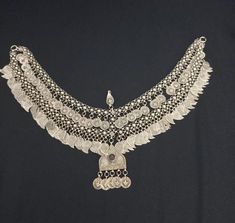 .This is a unique antique Ottoman period pedimented fez necklace featuring Ottoman jewellery. It is a beautiful representation of Ottoman jewelry. The necklace is made of low carat silver, a low grade silver, and is an original piece produced before 1920. Its originality makes it a valuable addition to any collection. , This necklace is perfect for those interested in Ottoman clothing and jewelry. Ottoman Clothing, Ottoman Jewelry, Antique Ottoman, Turkish Fashion, Bridal Headpiece, Unique Antiques, Bridal Headpieces, Costume Jewelry, Headpiece