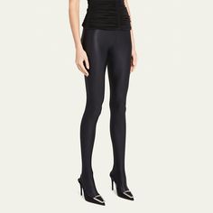 Saint Laurent footed leggings featuring a shiny finish  High rise Branded logo waistband Skinny, fitted legs  Full length Second-skin fit Pull-on style  Polyester/elastane Made in Italy High Stretch Footless Unitard, Sleek High Waist High Stretch Leggings, Elegant Thigh-high Compressive Bottoms, Chic Elastane Leggings For Party, Chic Party Leggings In Elastane, High Stretch Elastane Footless Legwear, Compressive High-cut Leg Elastane Legwear, Stretch Elastane Unitard For Night Out, Sleek High Waist Elastane Leggings