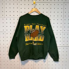 "Vintage 90s Green Bay Packers Russel Vintage Crewneck Sweatshirt Large Green Nfl Vintage 90's Green Bay Packers Size Large Green *50% Polyester *50% cotton *Tultex Tag *made in Usa *Tag reads:   Size :  Large (check measurements below) *Manual size measurement  Width : 24\" inches (armpit to armpit)                           Length : 27\" inches  All measurements are taken with the garment flat on the ground. *Condition: have a hole Good print  refer picture good vintage condition (8/10-80%) *OUR SHIPPING PRICE IS 25$ FOR EXPRESS SHIPPING (DHL EXPRESS).  FOR EXPRESS SHIPPING IT WILL TAKES ONLY 2-5 DAYS TO DELIVERED TO YOU.  ANY QUESTION PLEASE CONTACT US.  PLEASE SHOPPING WITH US WITH CONFIDENCE.  WE ARE TRUSTED SELLER, WE WILL GIVE THE GREAT SERVICE FOR YOU. Thanks!" Green Tops For Game Day In Winter, Relaxed Fit Throwback Tops For Fall, Retro Oversized Tops For Game Day, Oversized Retro Top For Game Day, Grunge Green Tops For Fall, 90s Style Sweatshirt For Game Day, Oversized Throwback Fall Tops, Oversized Throwback Top For Fall, Green Crew Neck Retro Top