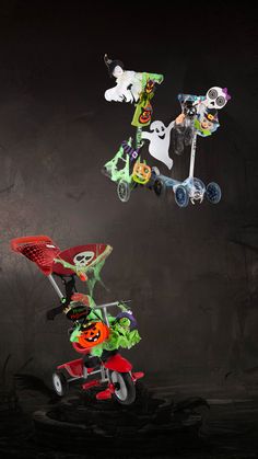 a group of halloween themed toys are flying in the air over a black background,