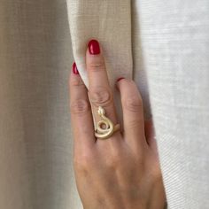 A wrap around sculpture snake with intricate detailing inside and out. Metal: 14k yellow gold Approx 4mm band width Available in rose, yellow or white gold. ON SALE: Size 7 ready to ship. Serpent Ring, Rose Yellow, Wrap Around, On Sale, Size 7, White Gold, Yellow Gold, Rose Gold, Sculpture