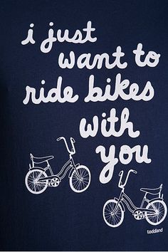 a man wearing a t - shirt that says i just want to ride bikes with you