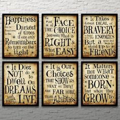 four framed canvass with different sayings on them