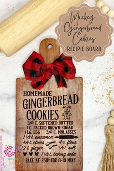 homemade gingerbread cookies recipe board with red ribbon