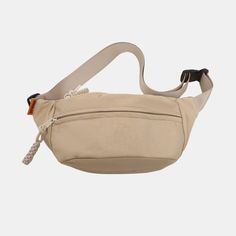 a beige fanny bag with an orange tag on the front and white strap around it