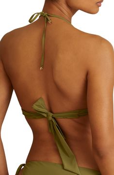 Look your best as you lay poolside in this bikini top featuring cutouts on the halter ties. Ties at neck and back 73% polyamide, 27% elastane Hand wash, line dry Imported Chic T-back Halter Top For Beach, Green Triangle Halter Top With Built-in Bra, T-back Tie Back Halter Top For Vacation, Poolside Nylon Tankini With Triangle Top, Beachwear Bandeau Halter Top For Swimming, Nylon Halter Top With Built-in Bra, Chic Tie Back Halter Top For Swimming, Backless Solid Halter Top For Beach Season, Stretch Halter Tie Back Triangle Top