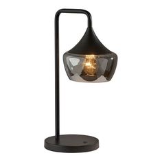 a black table lamp with a light bulb on it's side and a metal base