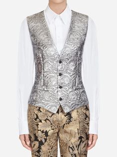 Dolce & Gabbana is your calling card if you're looking for feminine romance. The eye drawn to ornate embellishments, exquisite flower motifs, and look-at-me lace. This Baroque Waistcoat has a pattern, metallic sheen, front button closure. 2019 Runway, Your Calling, Floral Vests, Baroque Pattern, Cotton Long Dress, Jacquard Jacket, Flower Motifs, Silver Silk, Calling Card