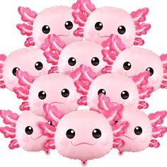 a bunch of pink octopus balloons sitting in the middle of a pile on top of each other